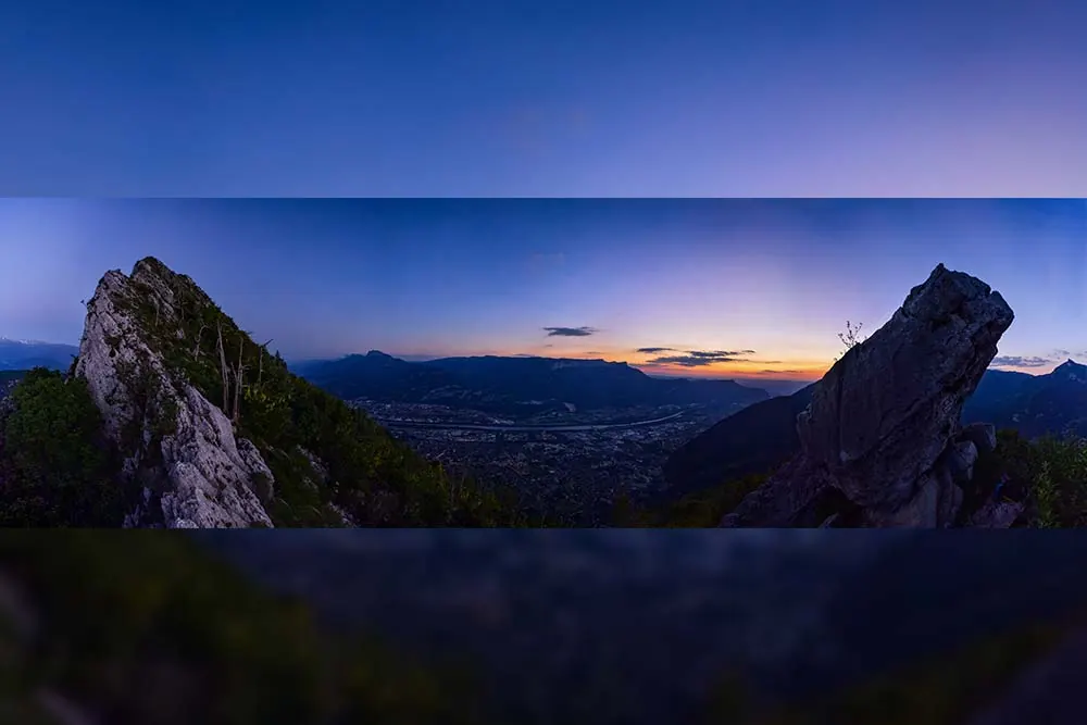 Panorama stitching of a mountain view at dusk
